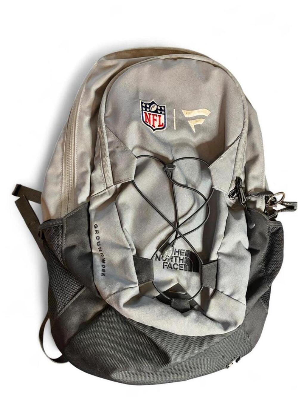 The North Face Men's NFL Groundwork Gray and Silver Backpack with Bungee Cord